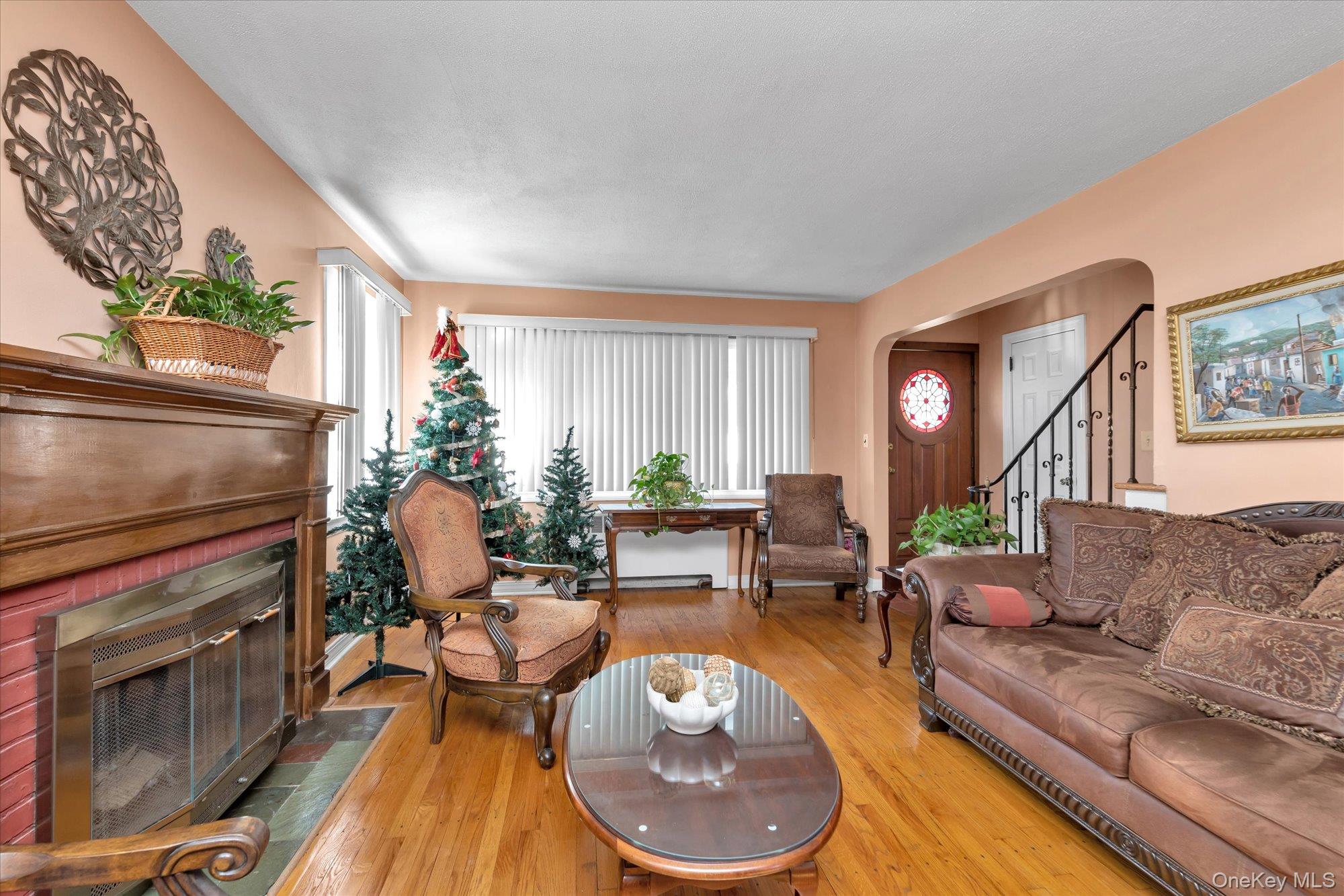 89 Foster Avenue Valley Stream, NY 11580 - Photo 3 of 20 Living room featuring hardwood floors and fireplace