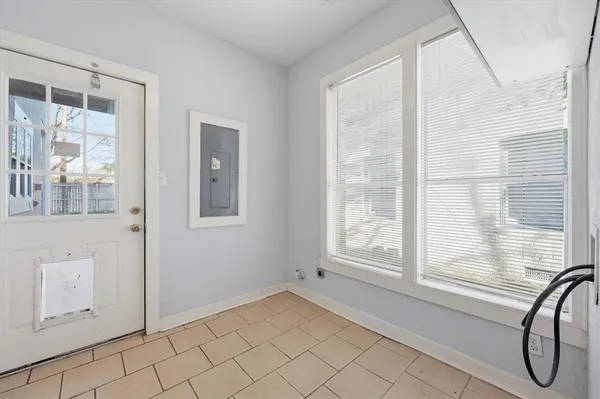 a view of a livingroom with wooden floor and white walls