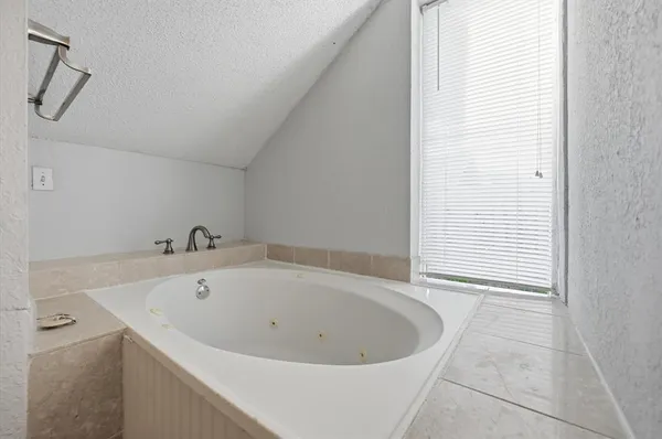 a view of a bathtub in a bathroom