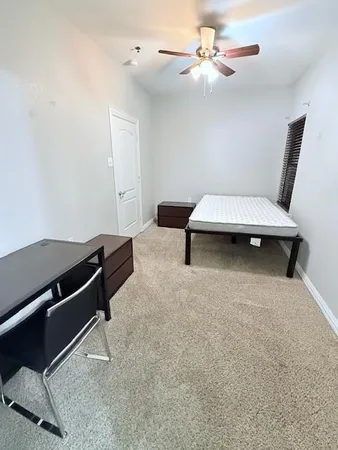 a bathroom with a sink a toilet a mirror and bathtub