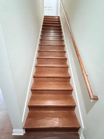 a room with chair and wooden floor