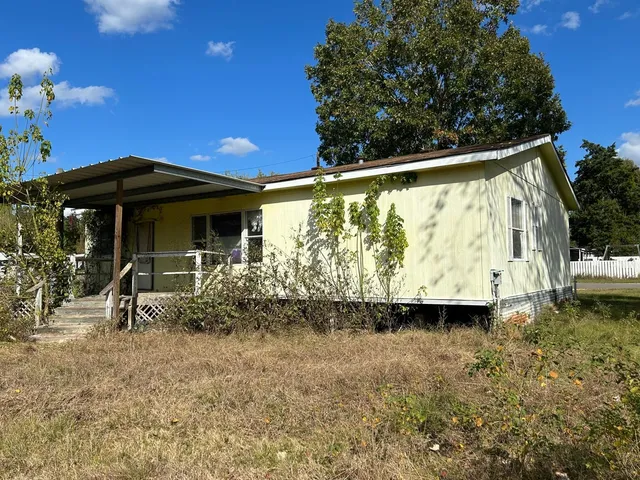 a view of a yard with an outdoor space