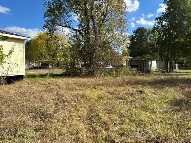 a backyard of a house with lots of green space