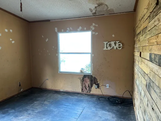 a view of an empty room with a window