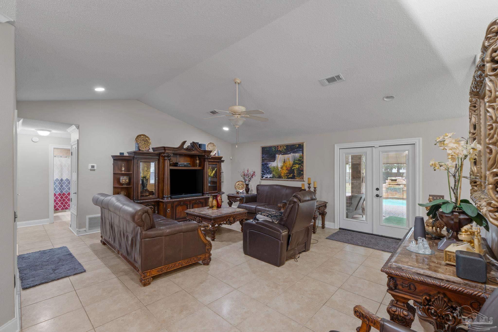 5692 Als Way Milton, FL 32583 - Photo 12 of 68 a living room with fireplace furniture and a flat screen tv