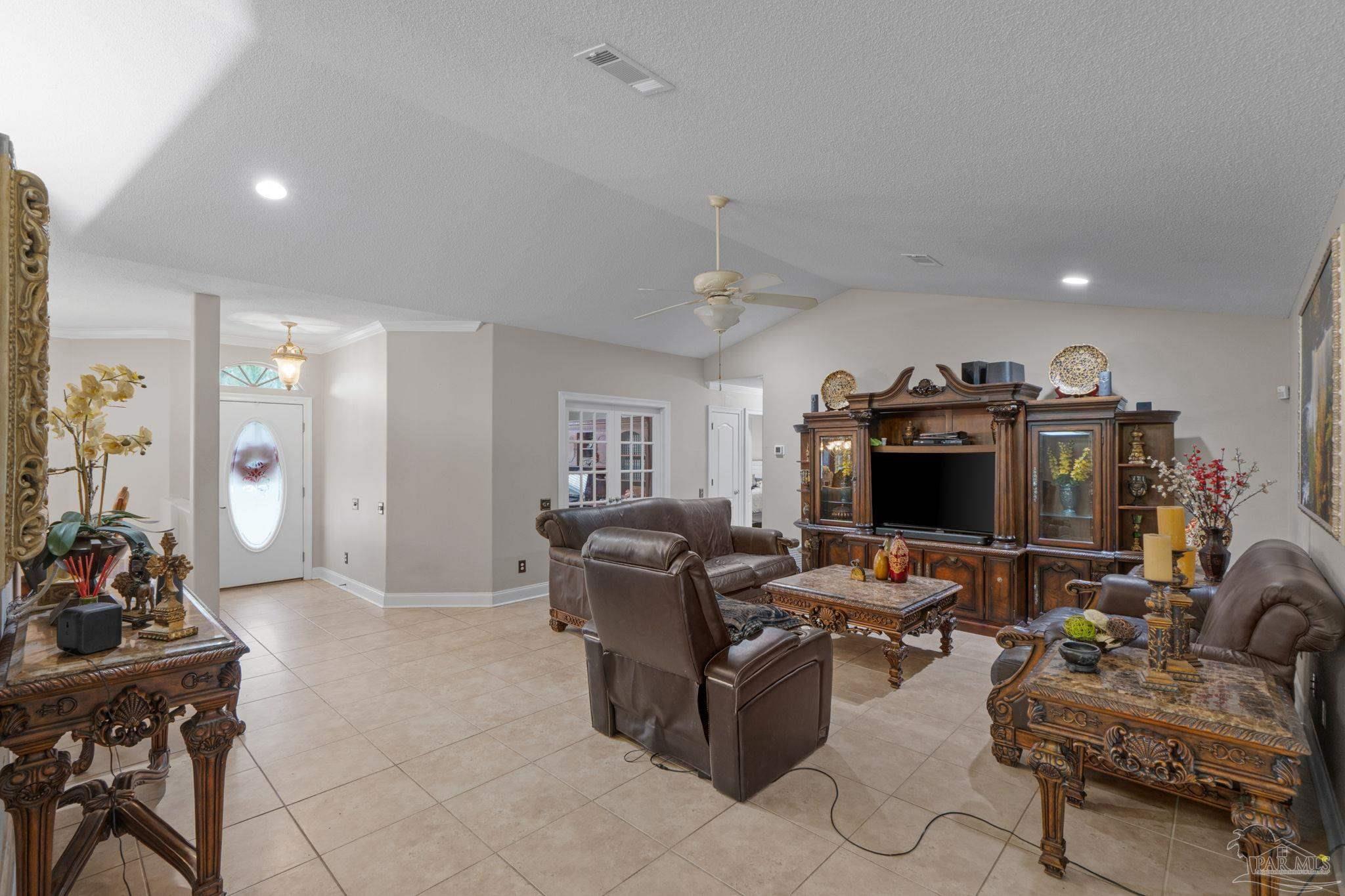 5692 Als Way Milton, FL 32583 - Photo 13 of 68 a view of a livingroom with workspace and a couch