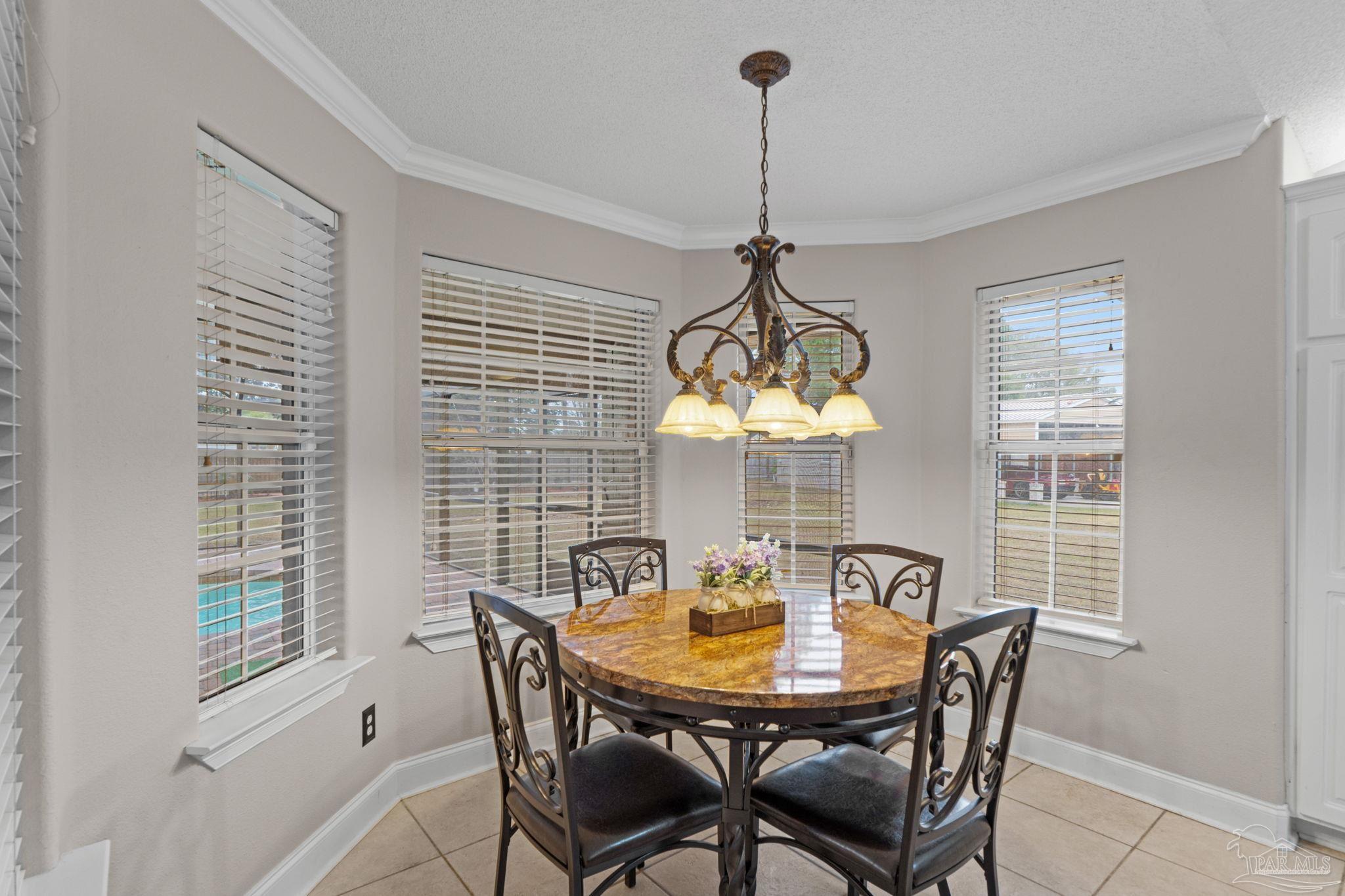 5692 Als Way Milton, FL 32583 - Photo 15 of 68 a view of a dining room and a table and chairs