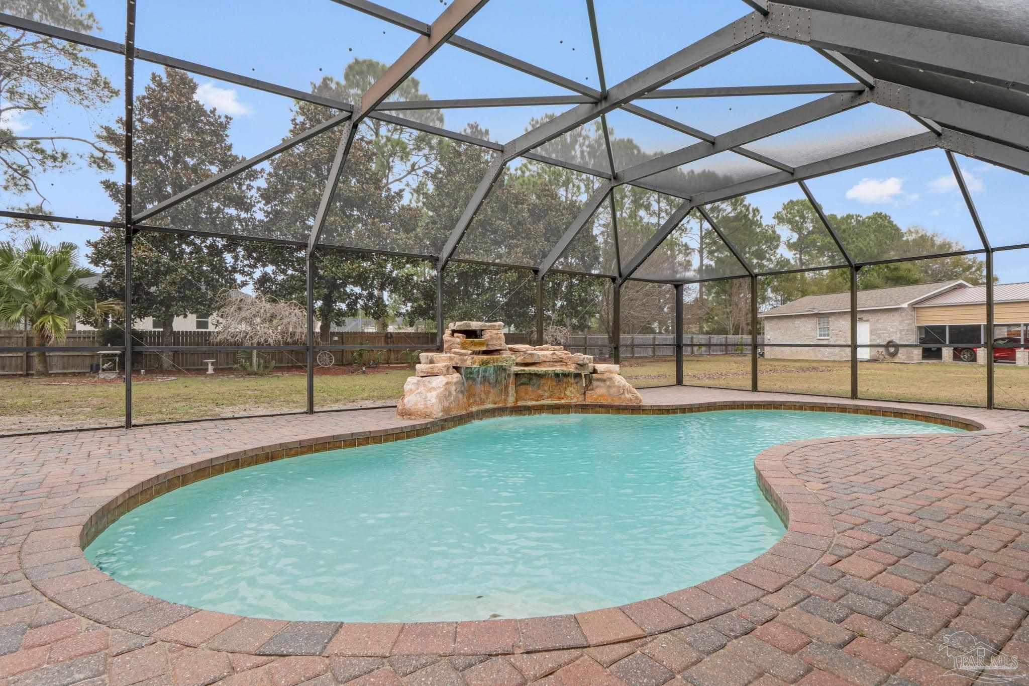 5692 Als Way Milton, FL 32583 - Photo 36 of 68 a view of a swimming pool with a yard