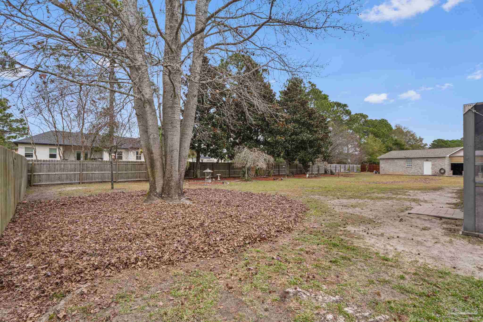 5692 Als Way Milton, FL 32583 - Photo 40 of 68 a view of outdoor space with deck and tree