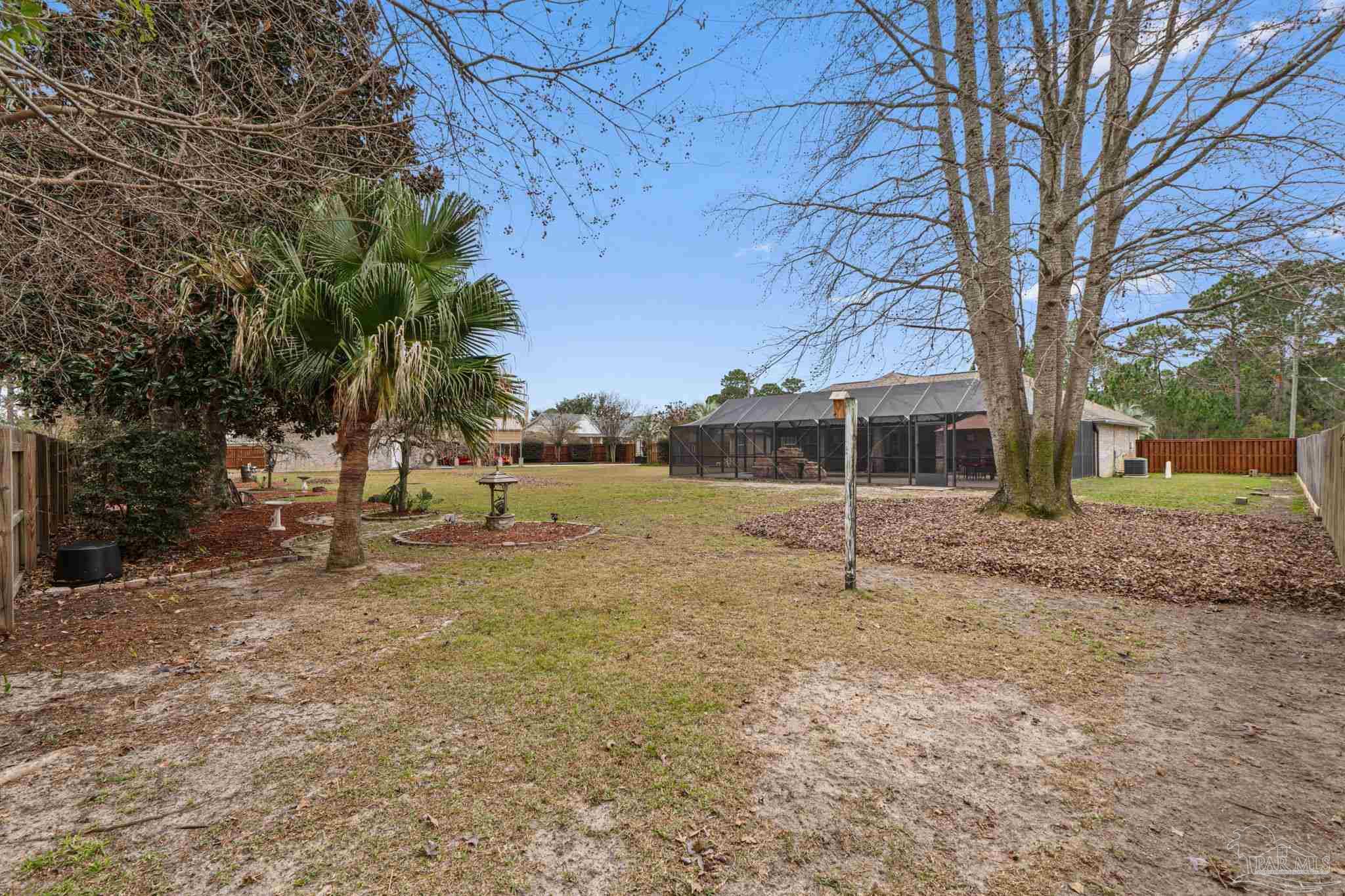 5692 Als Way Milton, FL 32583 - Photo 43 of 68 a house with trees in front of it