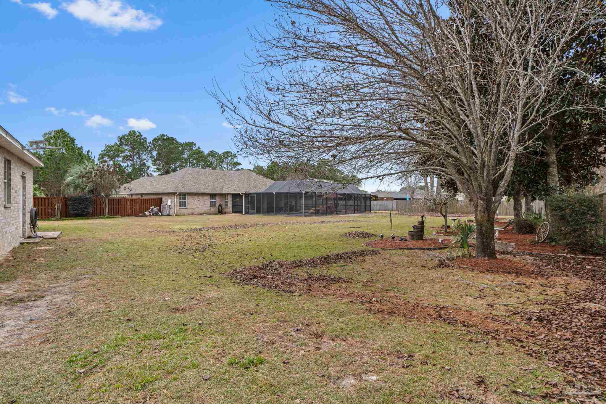 5692 Als Way Milton, FL 32583 - Photo 44 of 68 a front view of a house with a yard