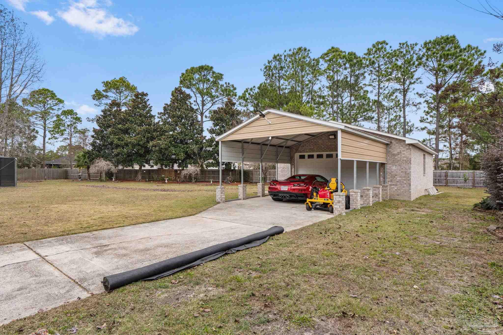 5692 Als Way Milton, FL 32583 - Photo 48 of 68 a view of a house with backyard and sitting area