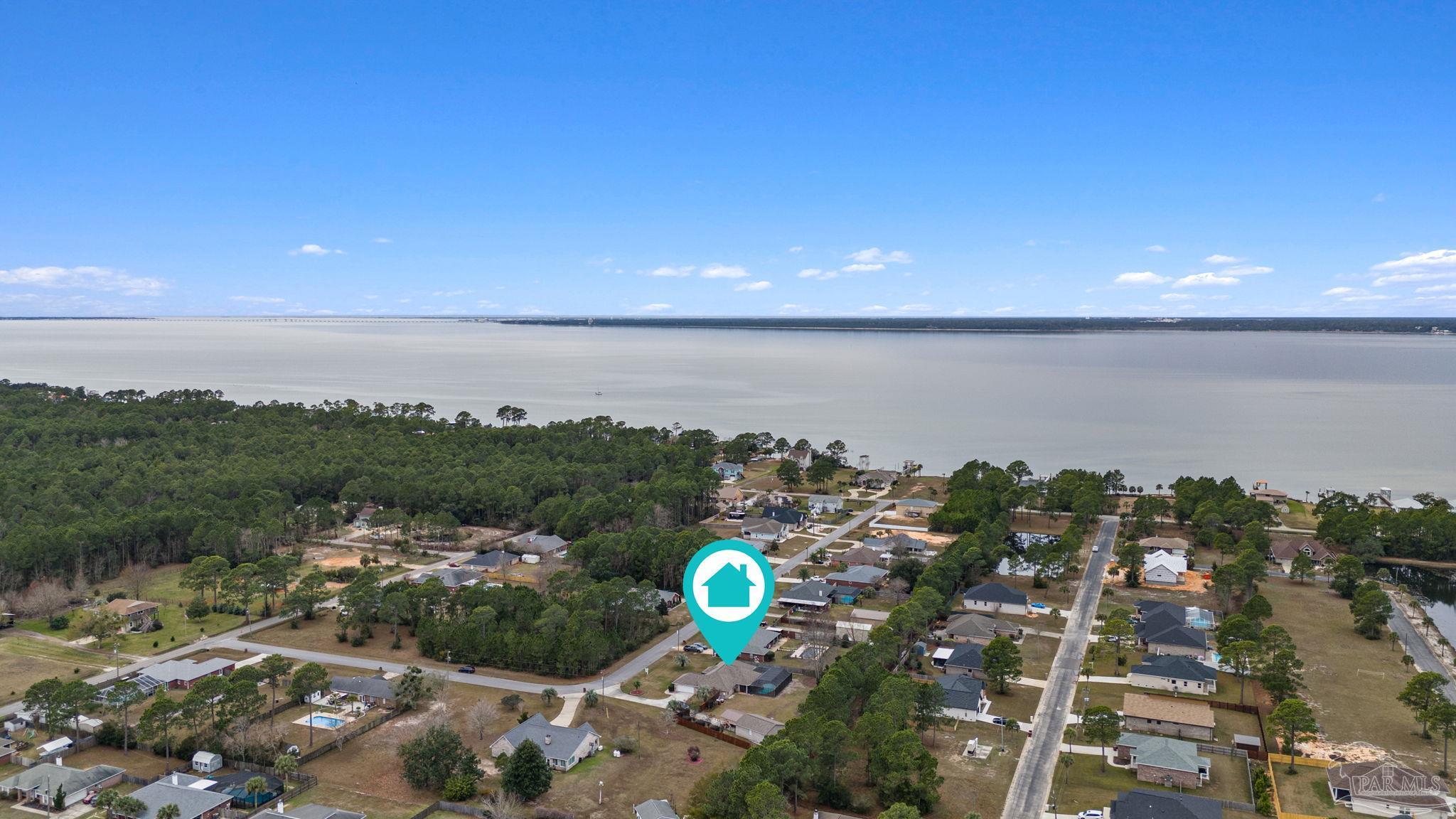 5692 Als Way Milton, FL 32583 - Photo 59 of 68 a view of a lake in middle of a city