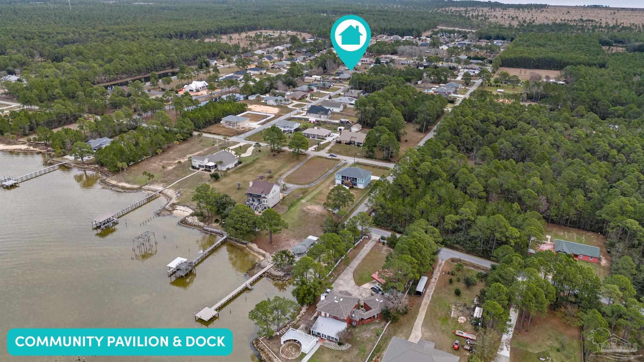 5692 Als Way Milton, FL 32583 - Photo 63 of 68 an aerial view of a house with a backyard