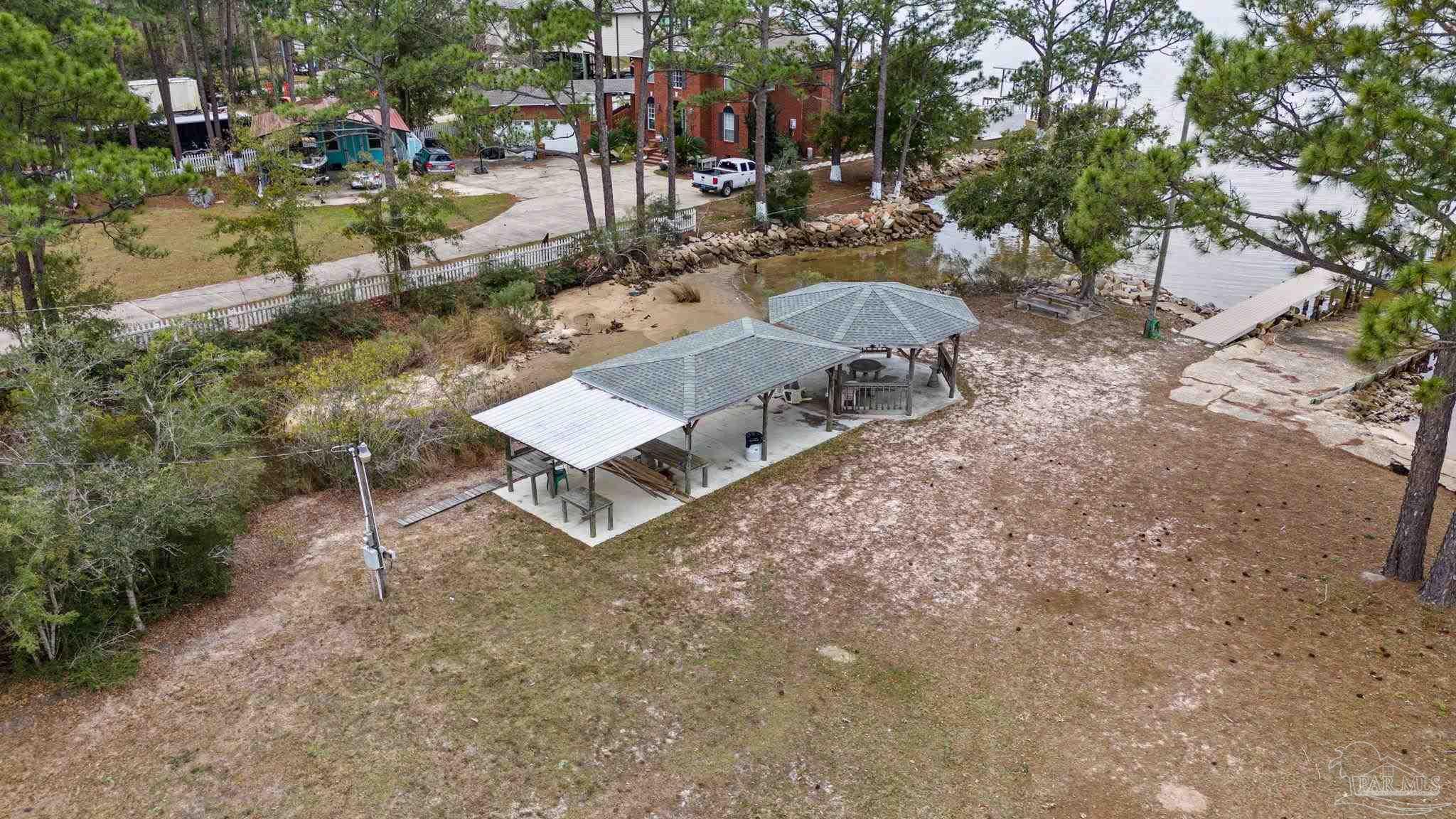 5692 Als Way Milton, FL 32583 - Photo 65 of 68 a view of a house with a yard and sitting area