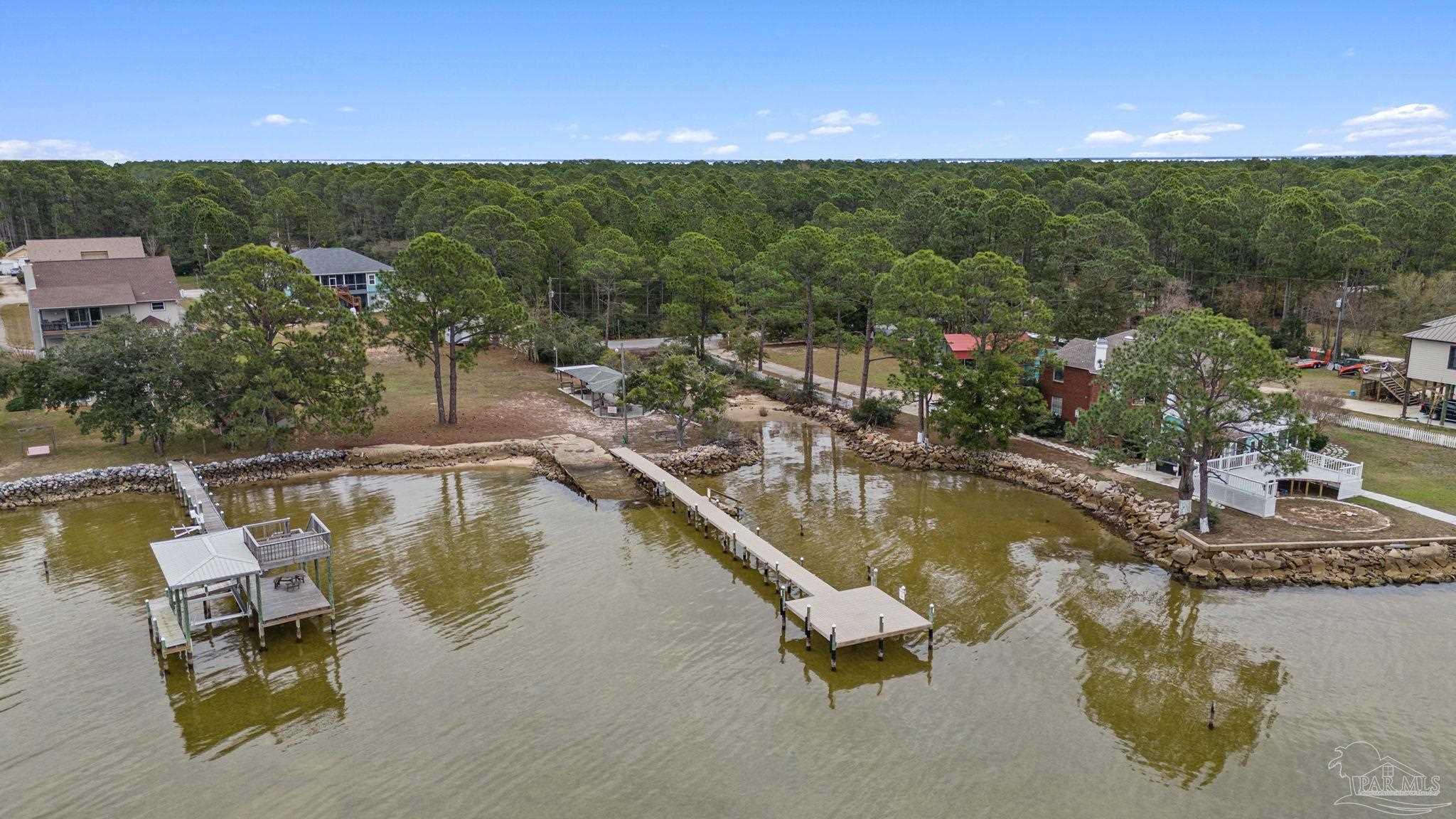 5692 Als Way Milton, FL 32583 - Photo 66 of 68 a view of a swimming pool and lounge chair
