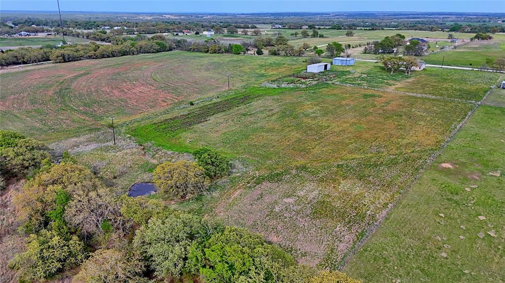 688 Alamo Road Montague, TX 76251 - Photo 18 of 35 an aerial view of residential houses with outdoor space and trees