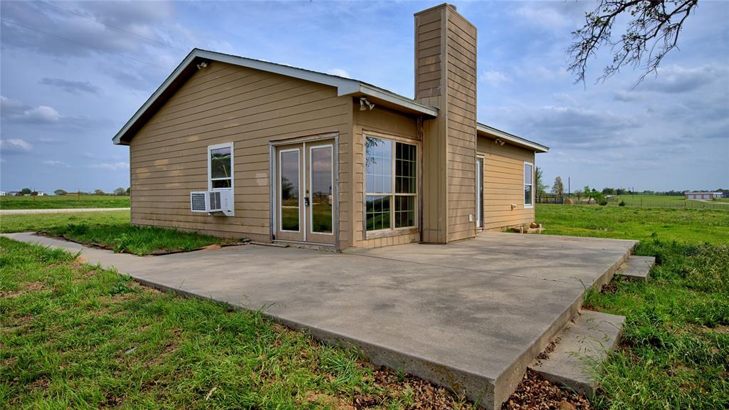 688 Alamo Road Montague, TX 76251 - Photo 22 of 35 front view of a house with a yard