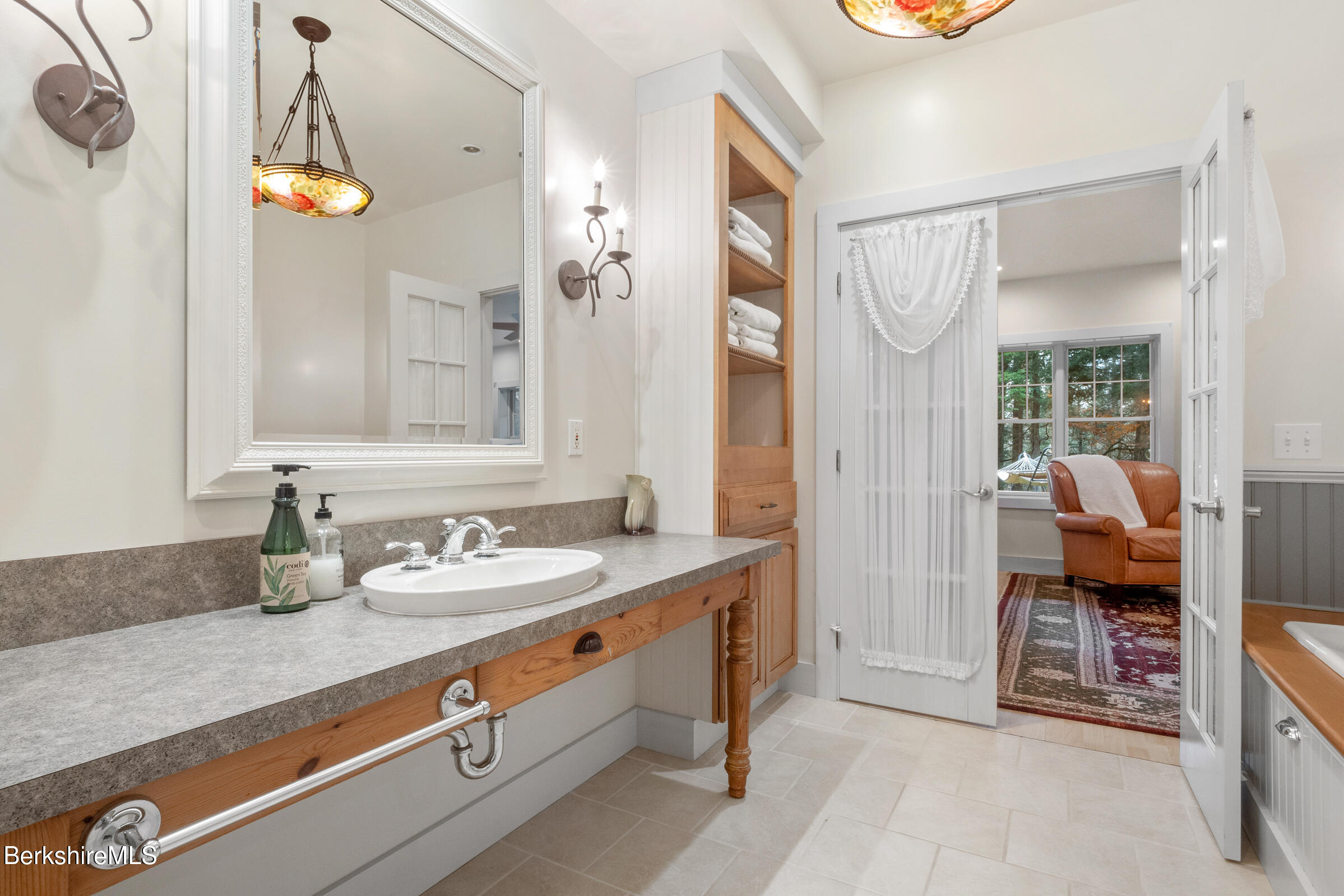 2017 Monterey Road Otis, MA 01255 - Photo 36 of 60 a en suite bathroom with a granite countertop sink and a mirror