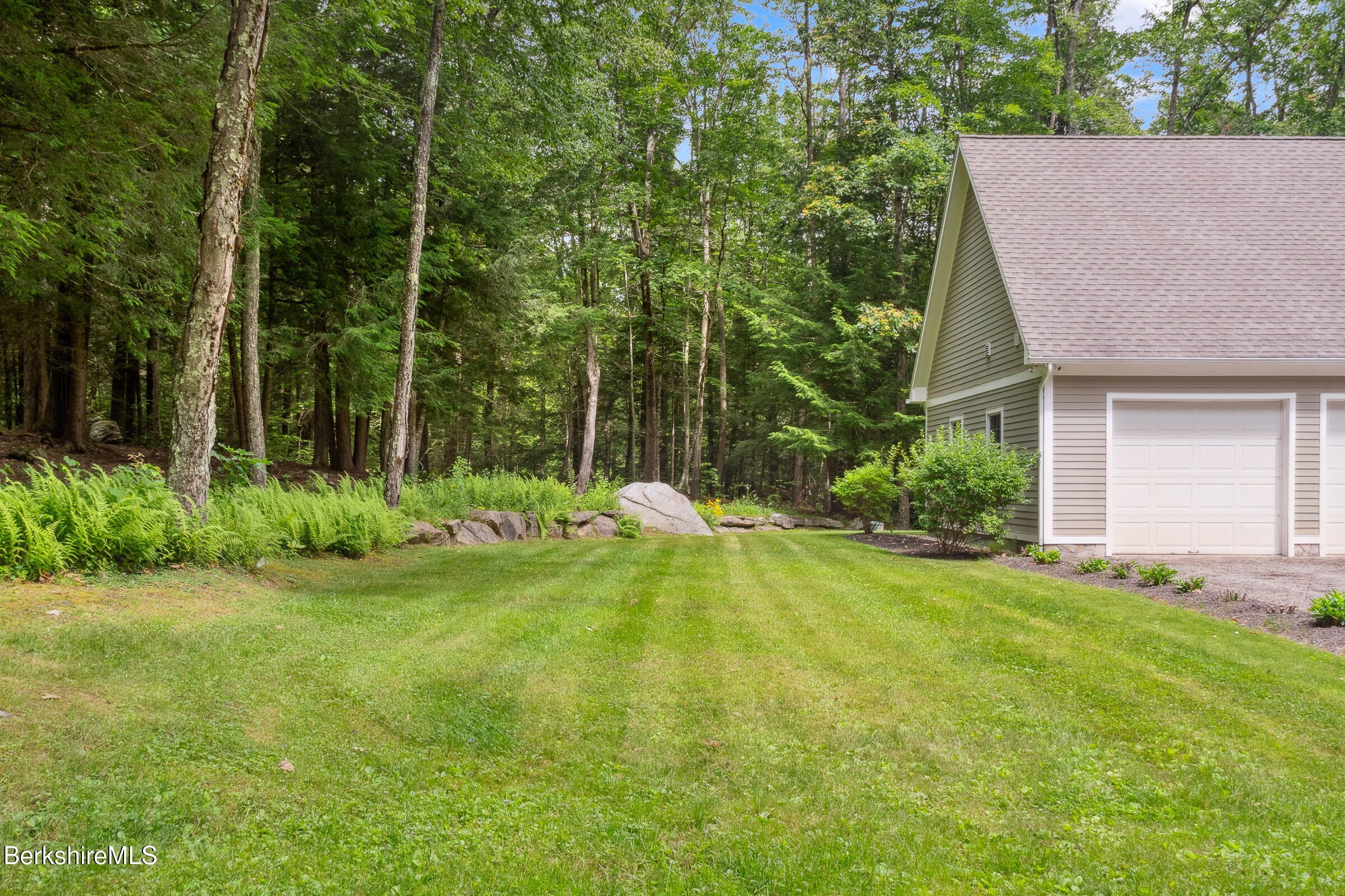 2017 Monterey Road Otis, MA 01255 - Photo 48 of 60 a view of a house with backyard and sitting area