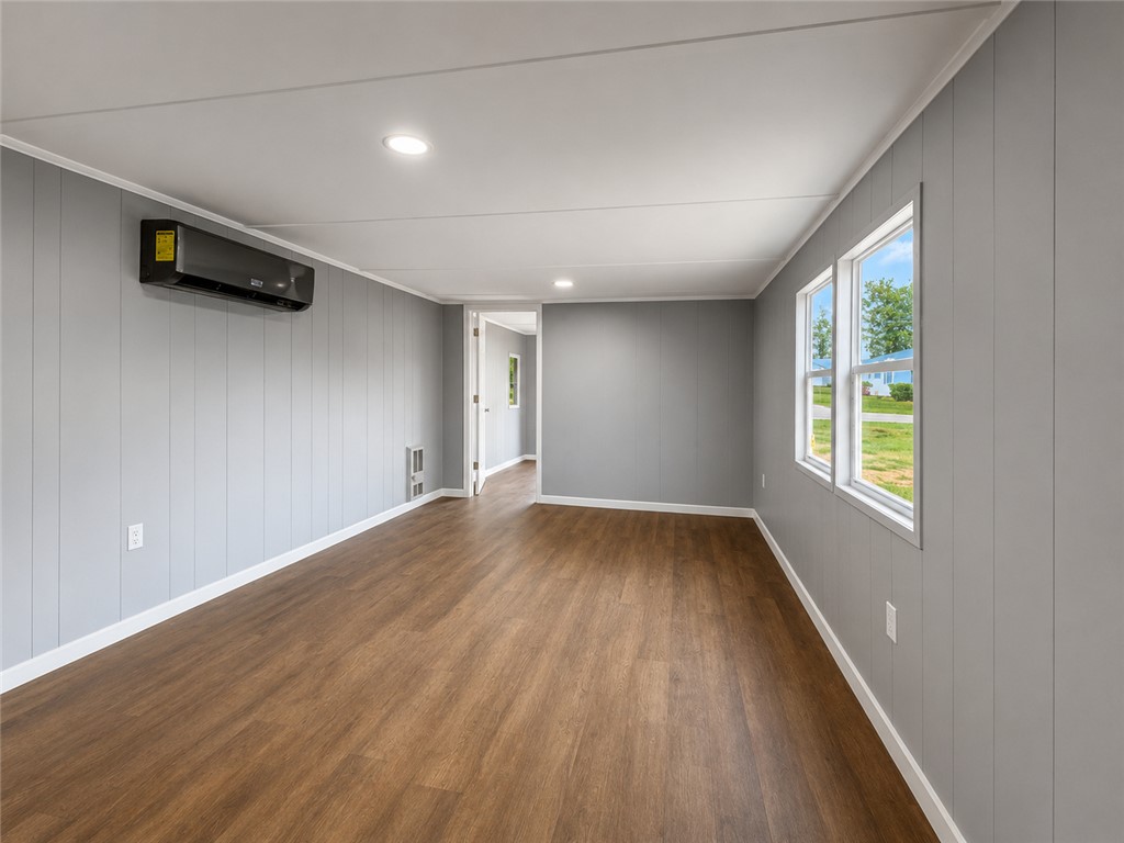 3301 Dixon Road Anderson, SC 29625 - Photo 6 of 20 A versatile living space with rich wood flooring and ample natural light.
