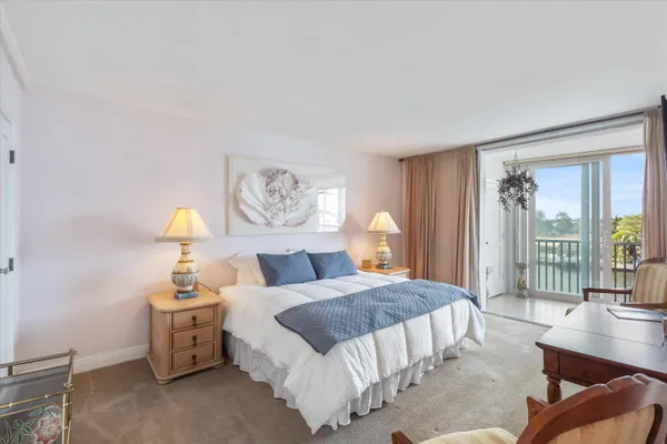 a bedroom with a bed and a chair