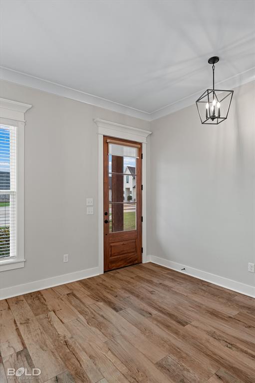 616 Meridian Way Benton, LA 71006 - Photo 11 of 40 a view of empty room with wooden floor and window