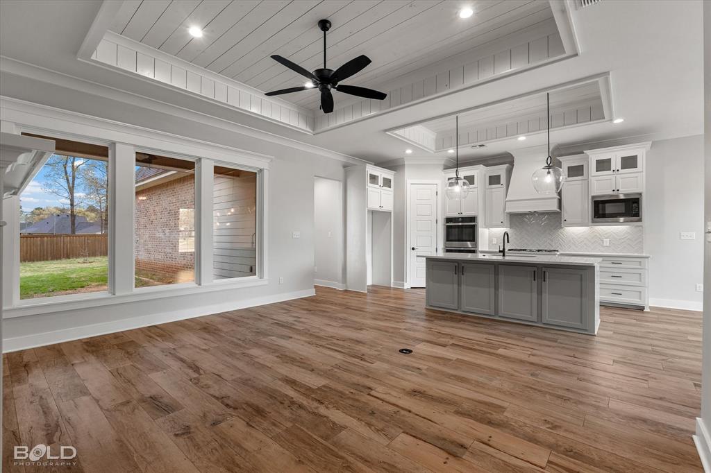 616 Meridian Way Benton, LA 71006 - Photo 38 of 40 a view of kitchen with granite countertop cabinets and refrigerator