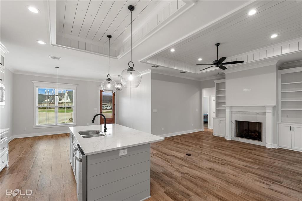 616 Meridian Way Benton, LA 71006 - Photo 39 of 40 a kitchen with kitchen island a sink stainless steel appliances and cabinets
