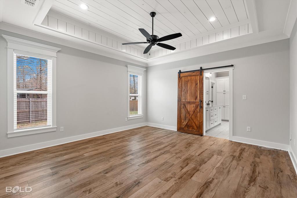 616 Meridian Way Benton, LA 71006 - Photo 20 of 40 a view of empty room with wooden floor and fan