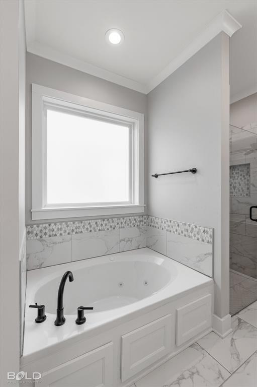 616 Meridian Way Benton, LA 71006 - Photo 24 of 40 a bathroom with a bathtub and a window