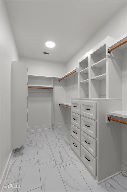 616 Meridian Way Benton, LA 71006 - Photo 25 of 40 a view of walk in closet with empty racks