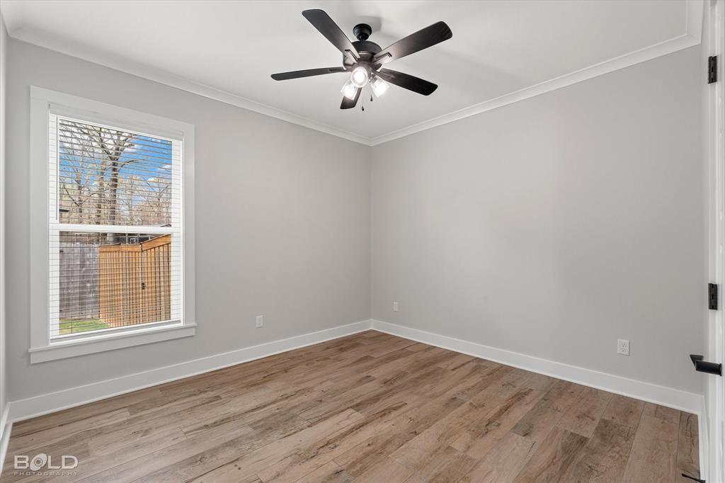 616 Meridian Way Benton, LA 71006 - Photo 26 of 40 wooden floor in an empty room with a window