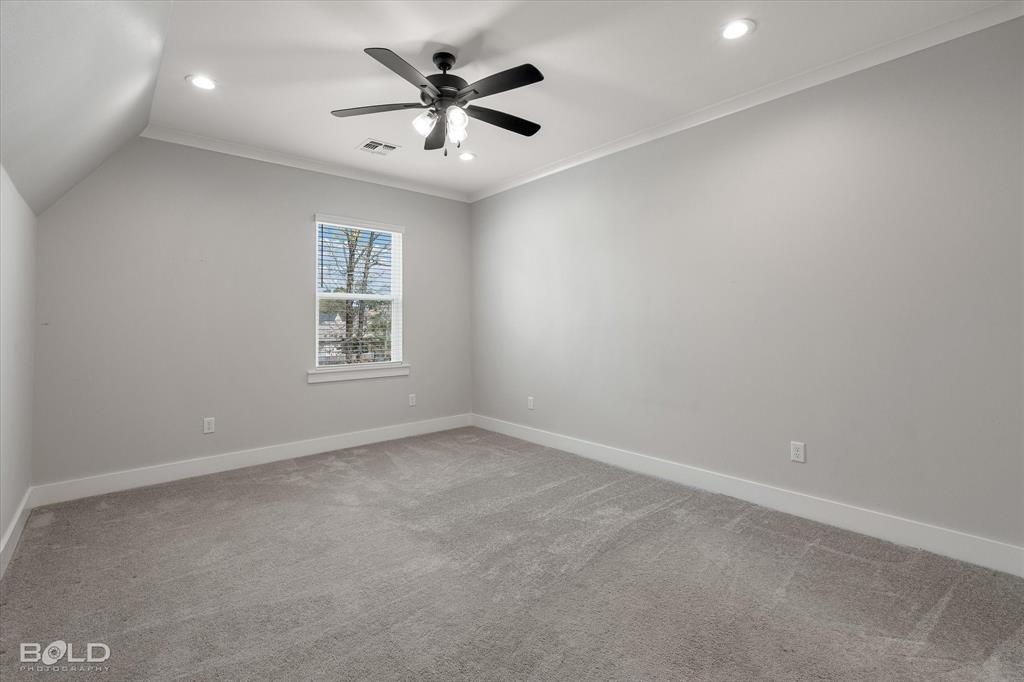 616 Meridian Way Benton, LA 71006 - Photo 30 of 40 an empty room with a window and a fan
