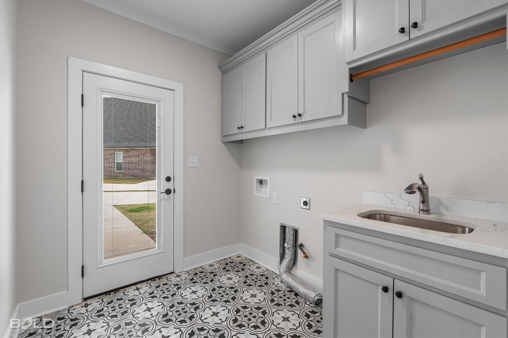 616 Meridian Way Benton, LA 71006 - Photo 34 of 40 a bathroom with a sink and cabinets