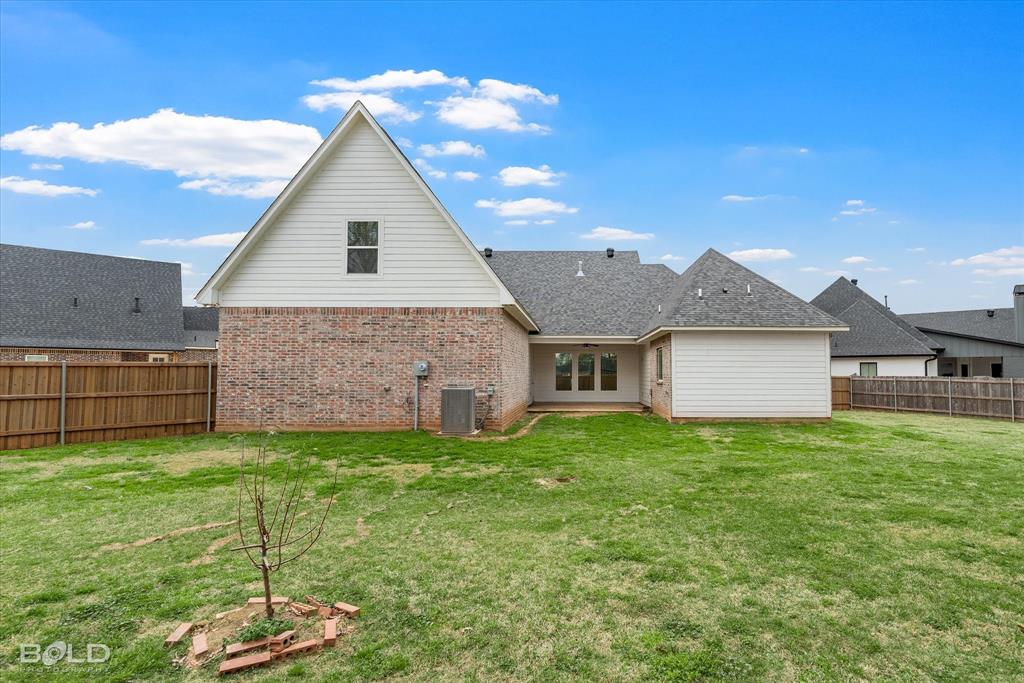 616 Meridian Way Benton, LA 71006 - Photo 7 of 40 a backyard of a house with table and chairs