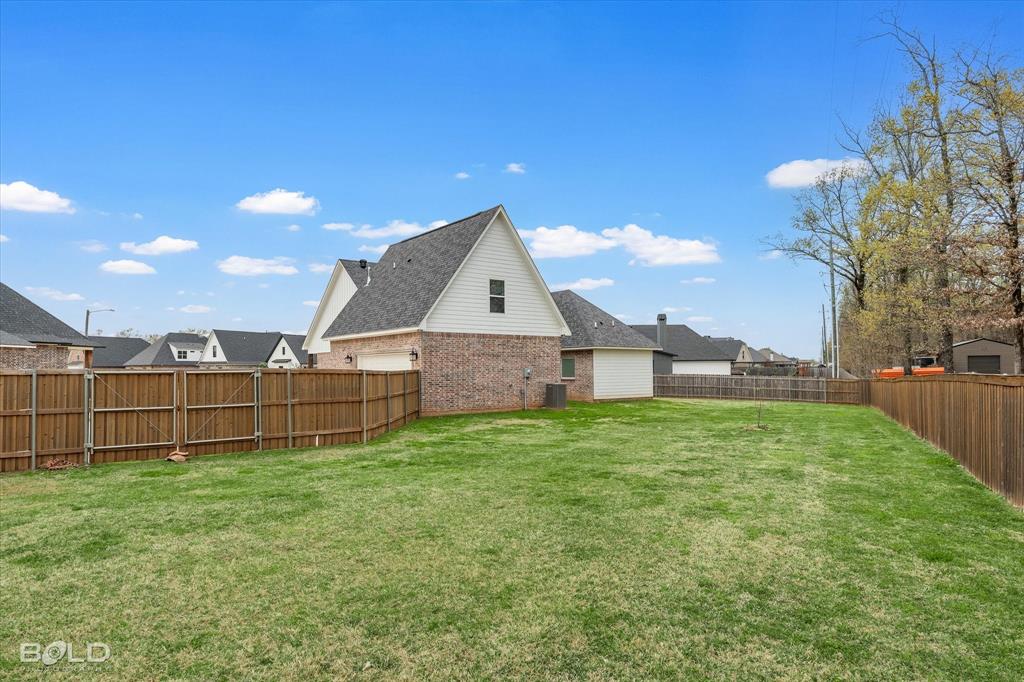 616 Meridian Way Benton, LA 71006 - Photo 8 of 40 a view of a house with a yard and sitting area