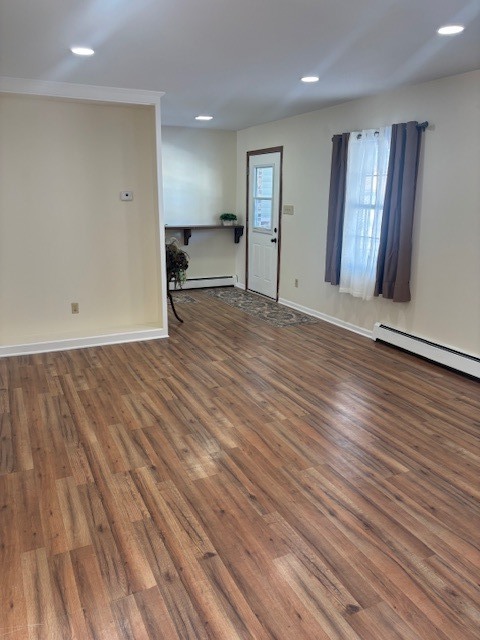 587 Phillips Circle Antioch, IL 60002 - Photo 4 of 20 an empty room with wooden floor and a sink