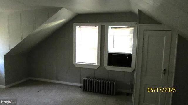 a view of a livingroom with an empty space and a window