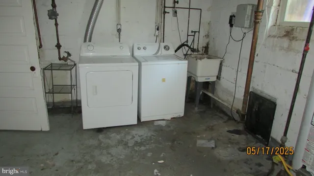 a view of a room with water heater and stairs