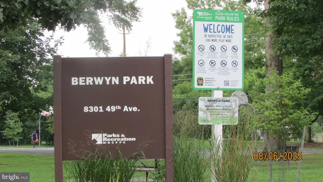 a sign broad on the side of the park