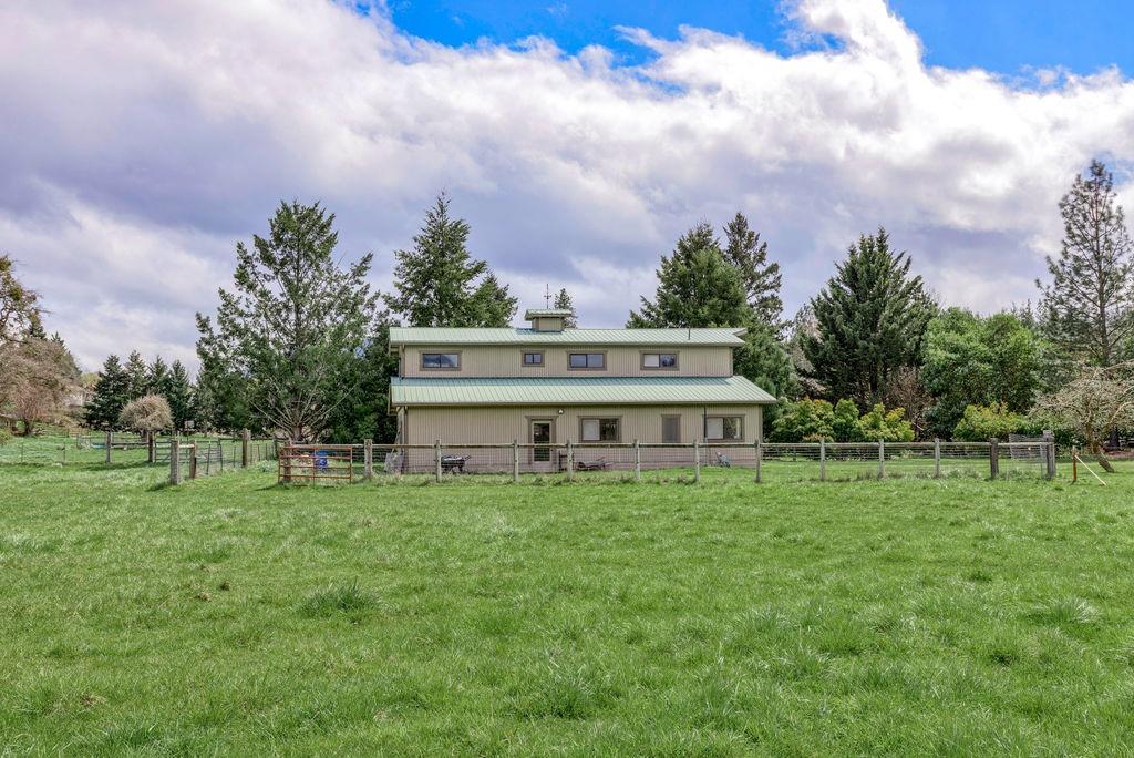 2076 Upper Applegate Road Jacksonville, OR 97530 - Photo 33 of 35 a view of a house with a big yard and a large tree