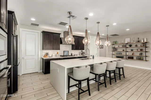 a bedroom with a bed and a table