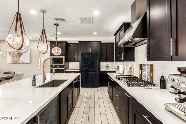 a living room with furniture and kitchen view