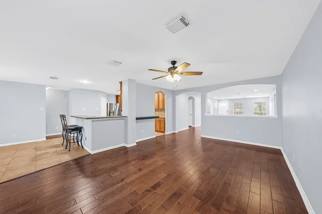 a view of kitchen with cabinets and wooden floor
