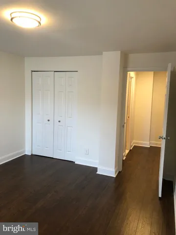 an empty room with wooden floor