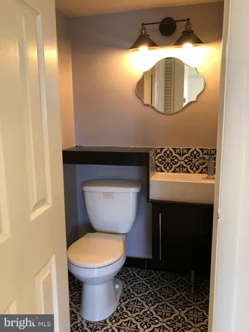 a bathroom with a toilet and a sink