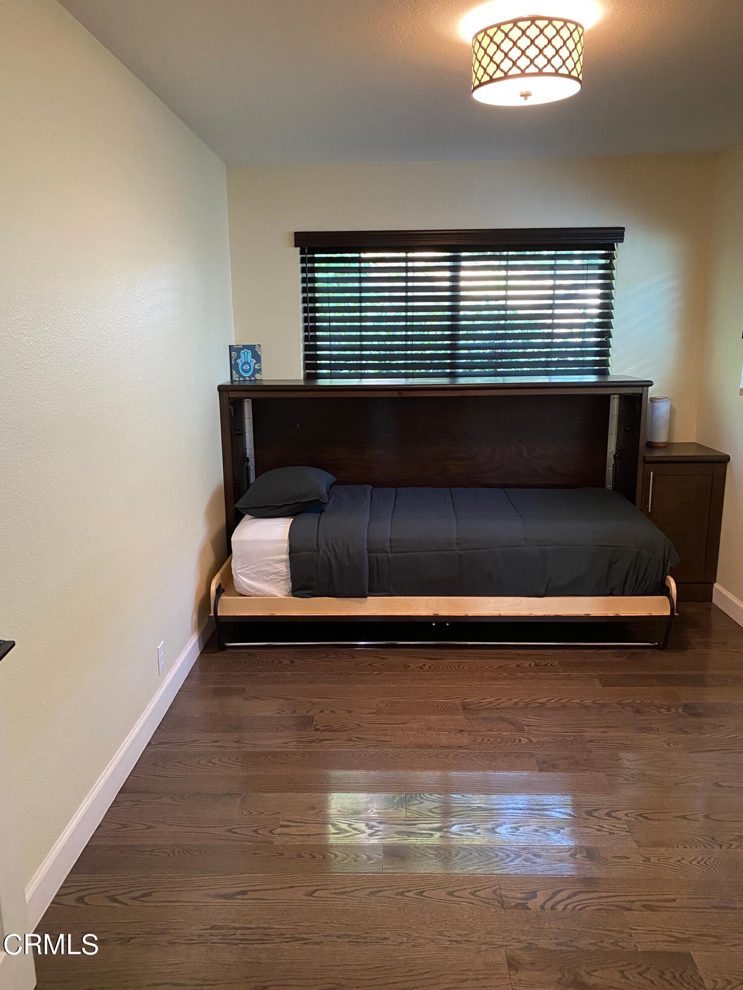 378 Grand Avenue Monrovia, CA 91016 - Photo 8 of 18 a view of empty room with wooden floor and fan
