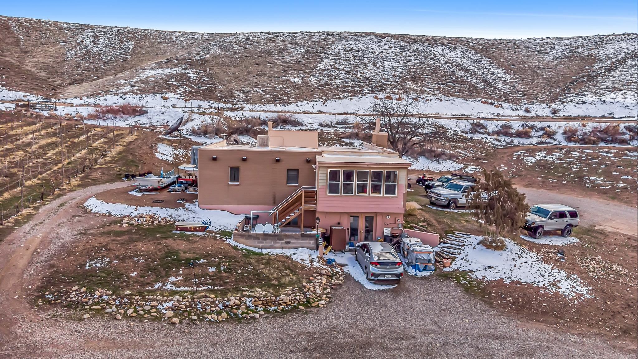 3553 1/2 E Road Palisade, CO 81526 - Photo 16 of 16 an aerial view of a house with a yard