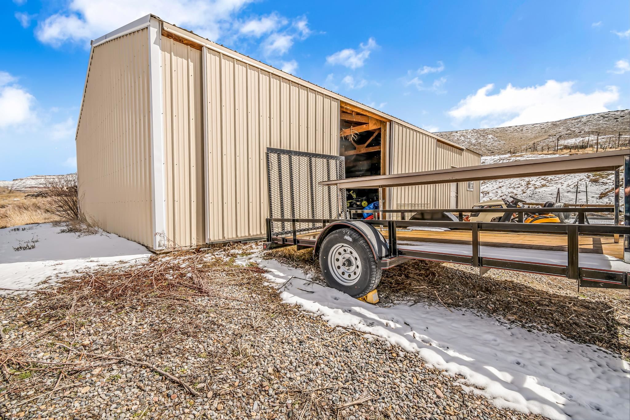 3553 1/2 E Road Palisade, CO 81526 - Photo 10 of 16 a view of a house with wooden fence